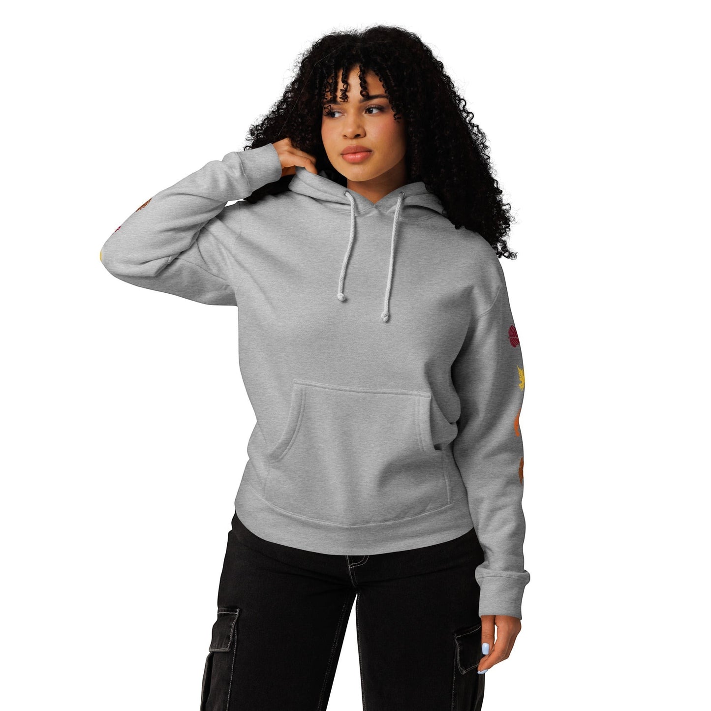 Clothing By Hot Takes Designs grey heavyweight fleece hoodie with relaxed fit worn by a woman with curly hair.