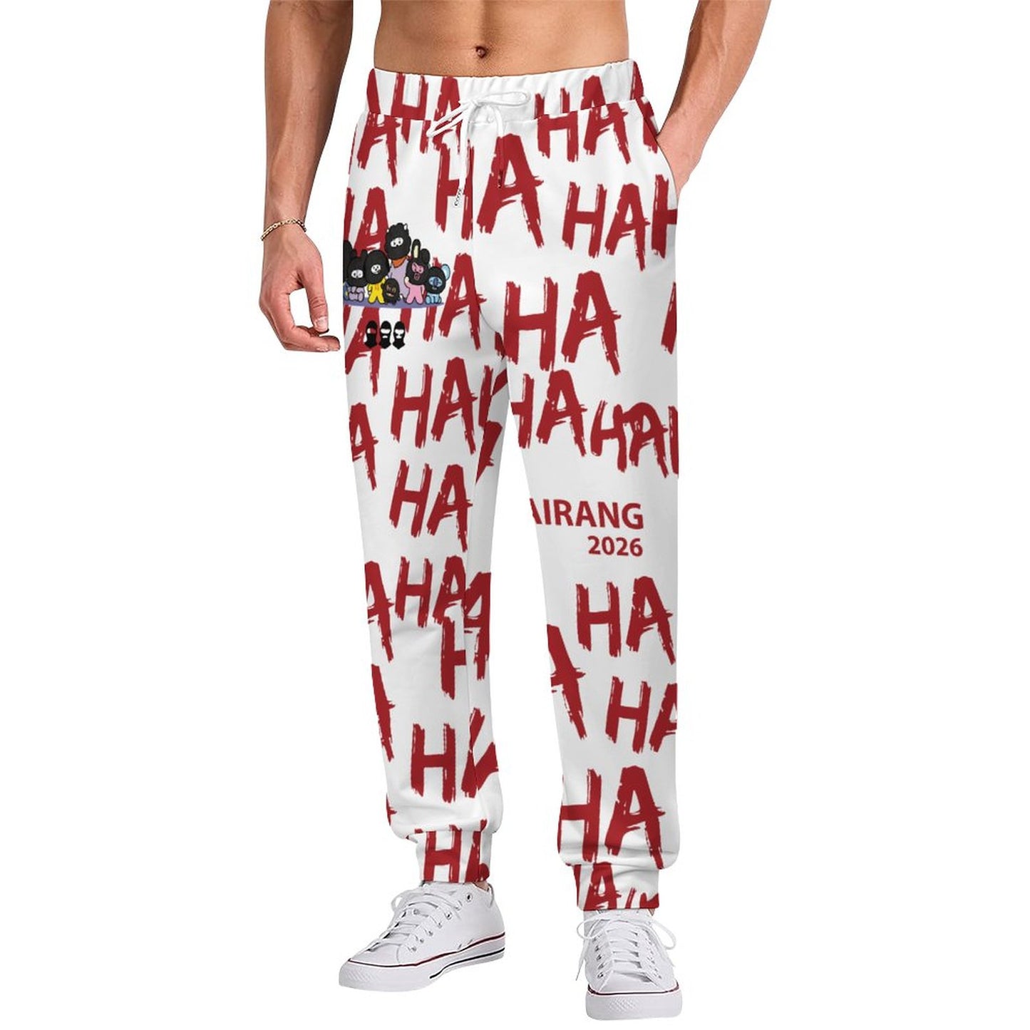 Front view of a model wearing the white BT21 Hooligan men's joggers featuring a vibrant all-over print character design.