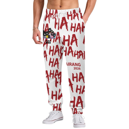 Front view of a model wearing the white BT21 Hooligan men's joggers featuring a vibrant all-over print character design.
