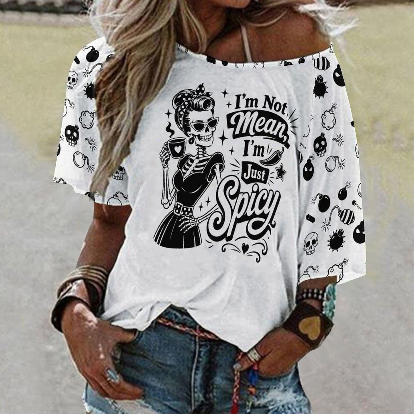 A model styled in a casual BookTok dark romance aesthetic outfit wearing the white graphic top slouched off-the-shoulder, highlighting the relaxed draping of the loose-fit design and 3/4 length sleeves.
