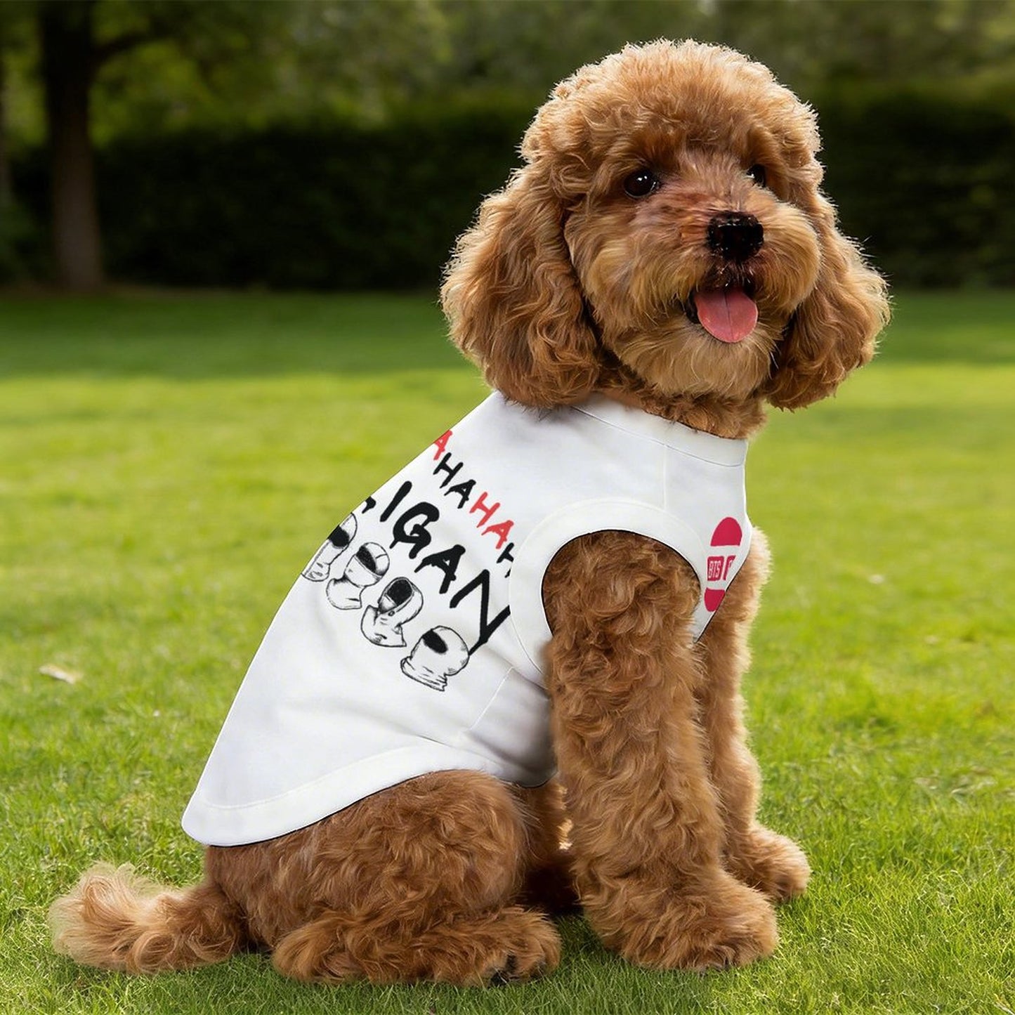 Small brown poodle wearing a white 'BTS Hooligan' pet cooling tank top in a park, showcasing K-pop fan apparel for dogs