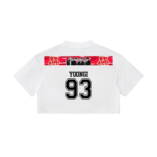 Back view of the white BTS Yoongi cropped paneled v-neck jersey, featuring a bold black 93 player number and Yoongi name print below a horizontal BTS band photo panel.