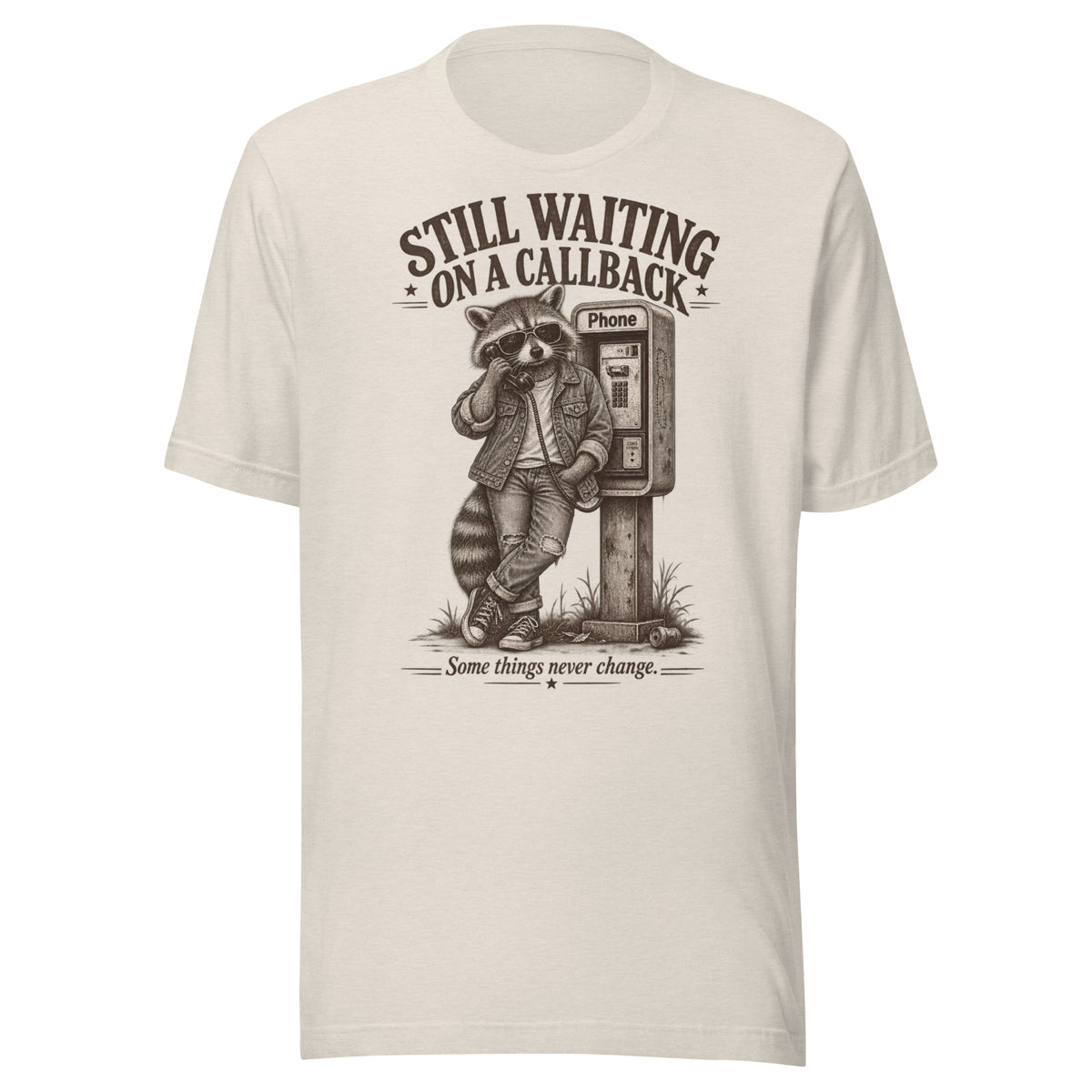 Front view of Still Waiting on a Callback funny raccoon graphic t-shirt in beige