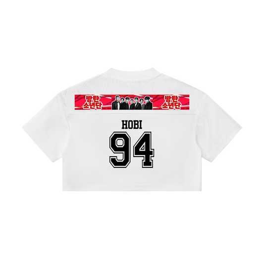 White t-shirt with graphic design and text on the back