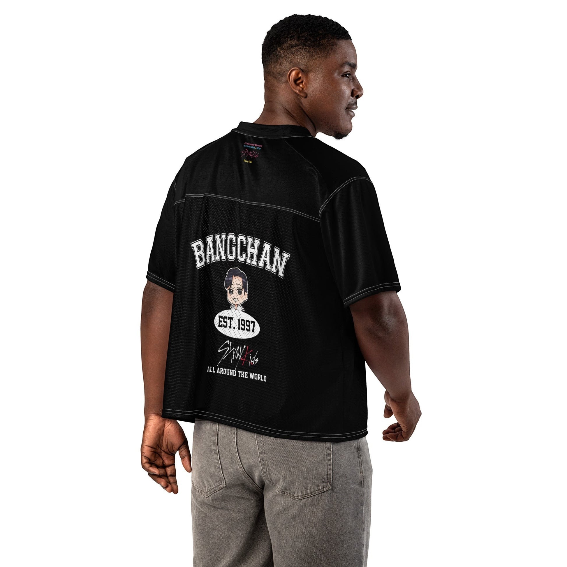 Clothing By Hot Takes Designs black boxy football jersey with Bang Chan graphic on back, worn by a man from behind.