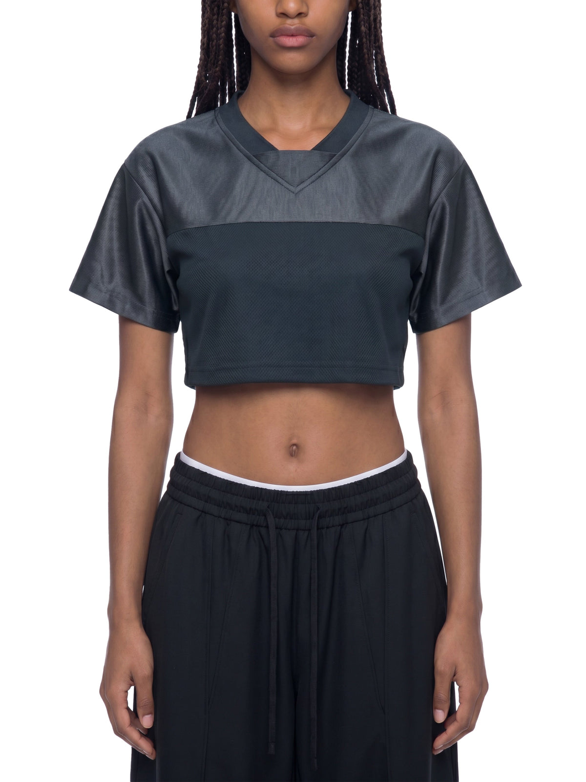 Clothing By Hot Takes Designs black cropped V-neck jersey with paneled detailing for a sporty streetwear look.