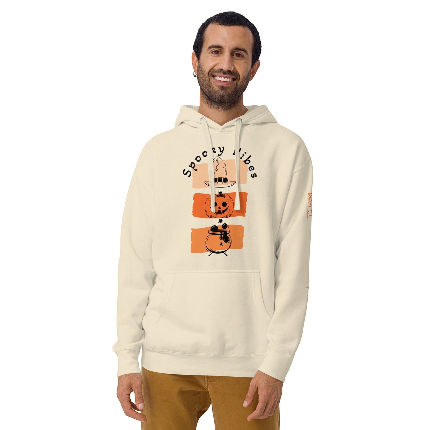 Clothing By Hot Takes Designs cream hoodie featuring a retro Spooky Vibes pumpkin and cauldron graphic for fall.