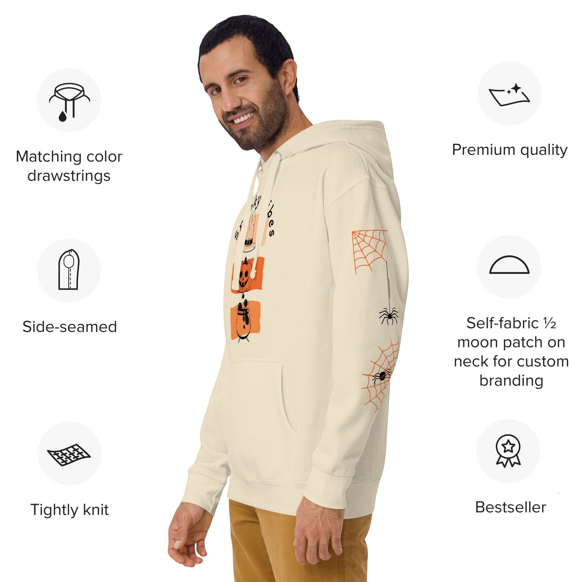 Clothing By Hot Takes Designs cream retro Halloween hoodie with pumpkin graphic and spider web sleeve print on a man