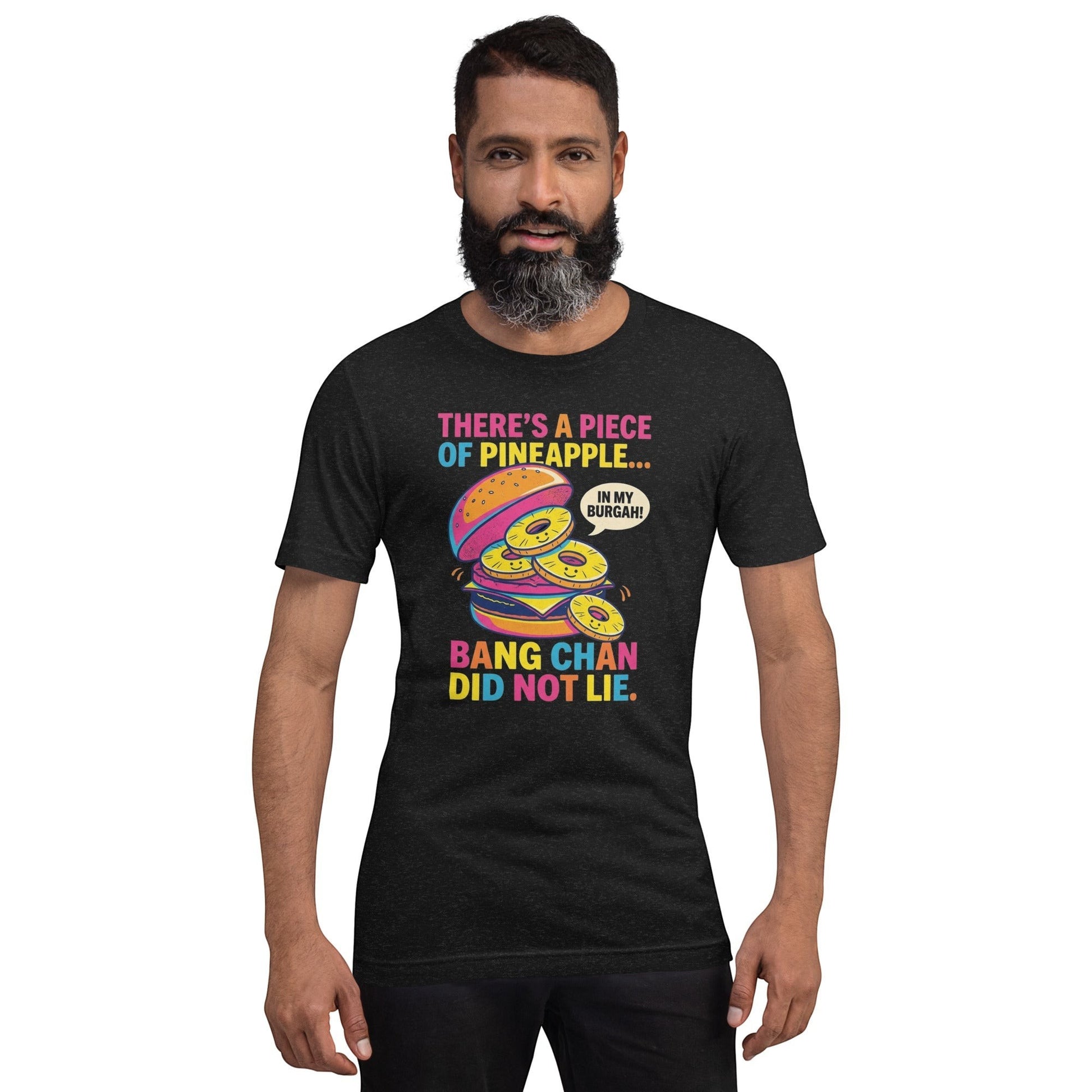 A man wearing a black heather Clothing By Hot Takes Designs graphic t-shirt featuring a pineapple burger illustration.