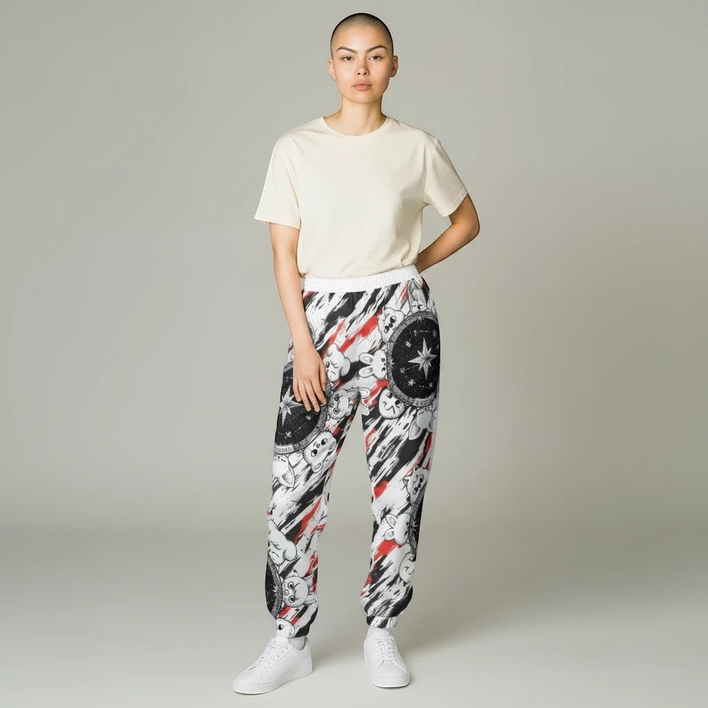 Clothing By Hot Takes Designs Stray Kids SKZOO inspired pajama joggers with a graphic print on a model in a cream tee