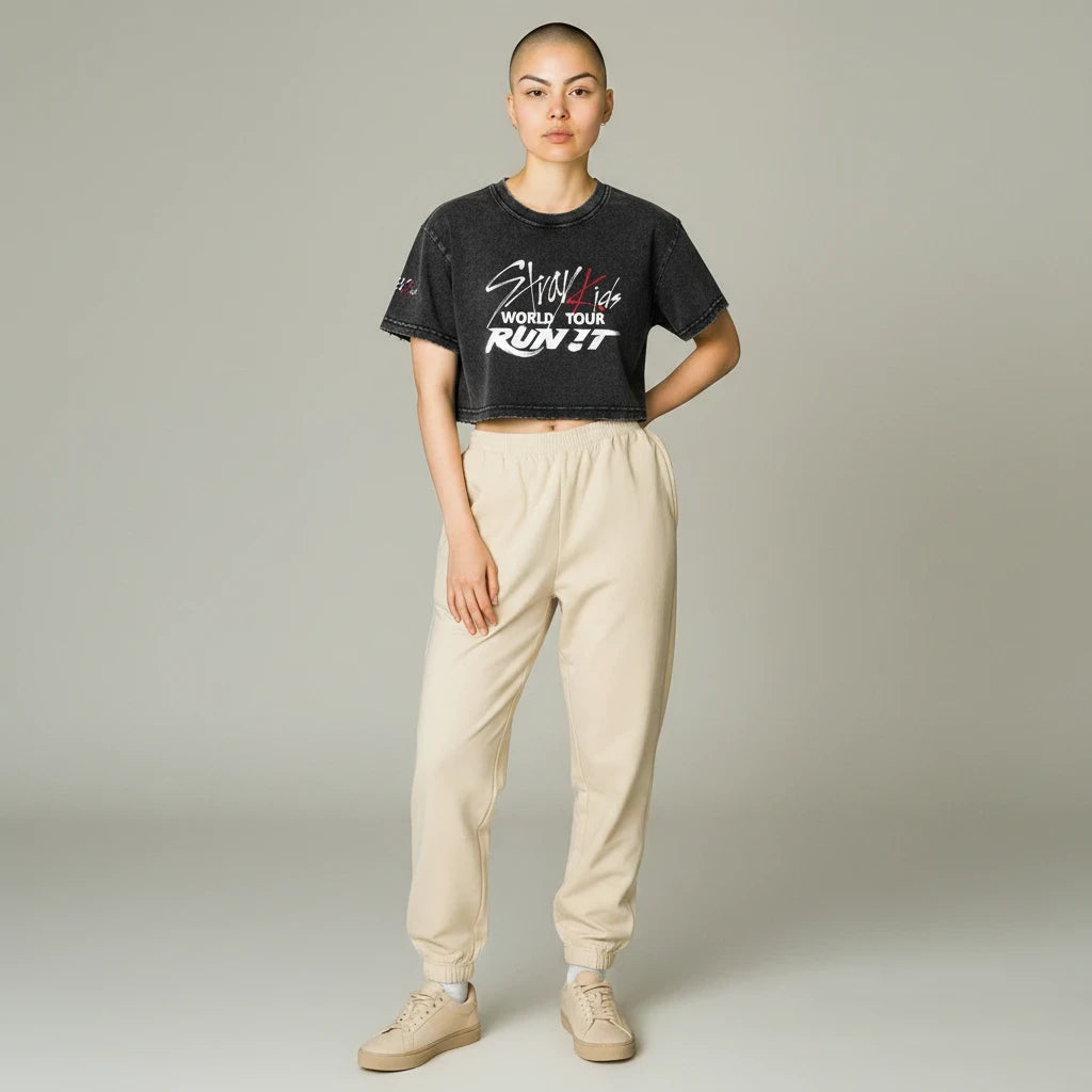 Clothing By Hot Takes Designs Stray Kids Run It distressed black cropped cotton t-shirt worn by a model.