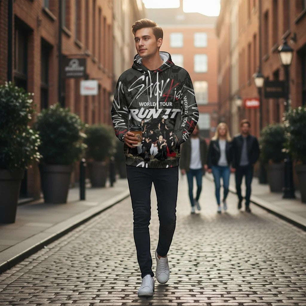 Clothing By Hot Takes Designs Stray Kids Run It tour hoodie with all-over graphic print worn by a man on a city street