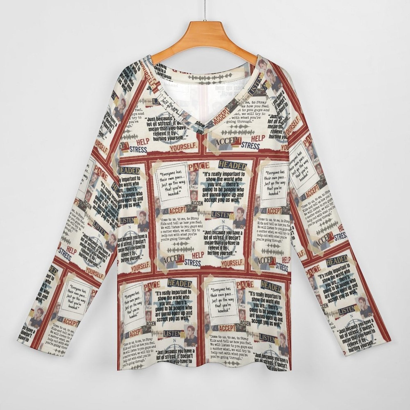 Clothing By Hot Takes Designs long-sleeve V-neck top in soft milk silk with an all-over newspaper-style print.