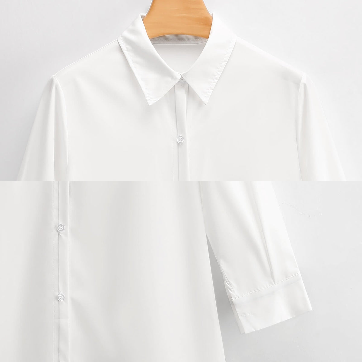 Clothing By Hot Takes Designs white button-down shirt dress with a classic collar and long sleeves on a hanger.