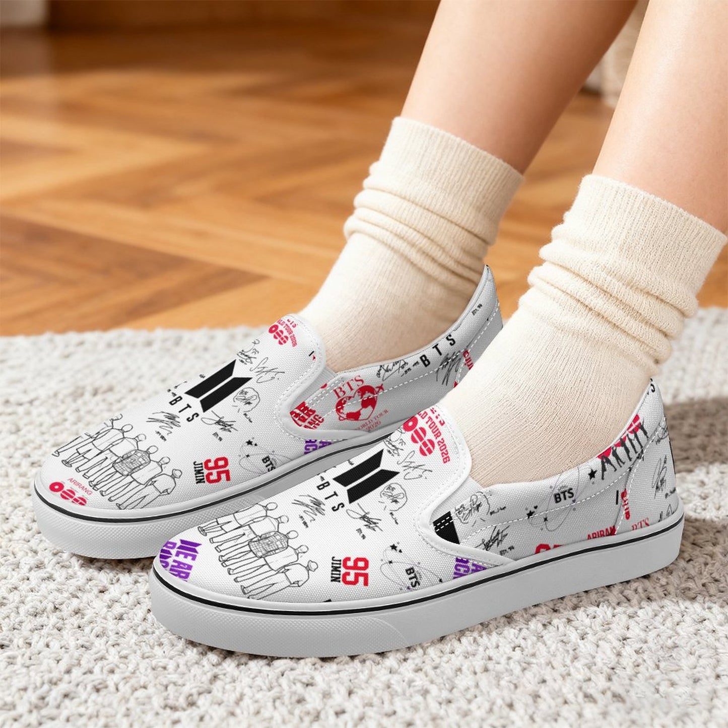 Pair of white BTS Hooligan inspired unisex slip-on canvas shoes