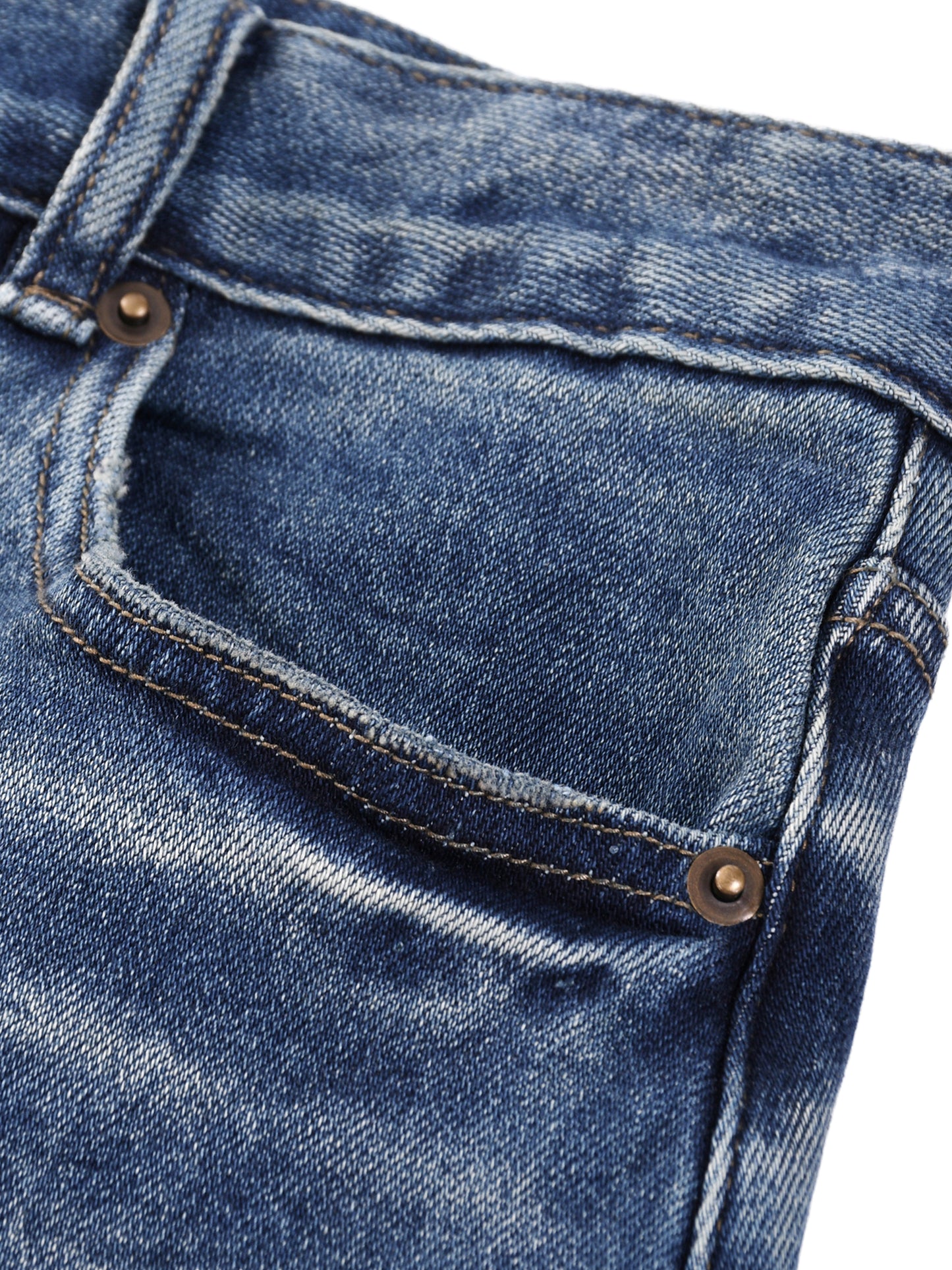Close-up view of the front pocket construction, metal rivets, and sun-faded wash detailing on the BT21 King TATA denim jeans.