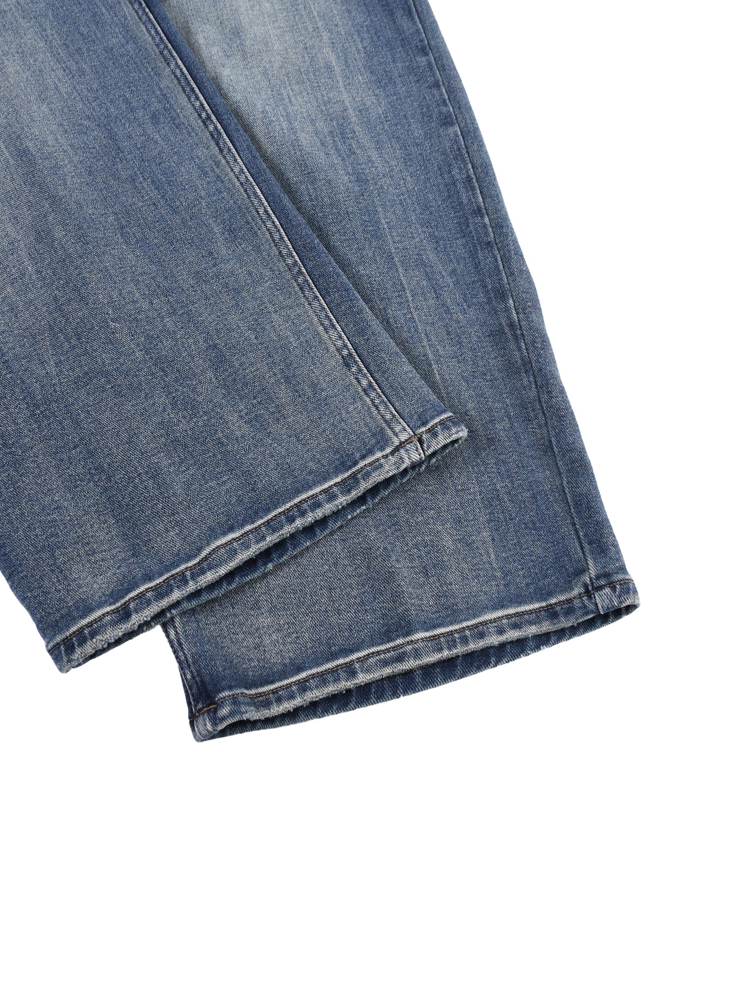 Close-up view of the clean, double-stitched ankle cuffs and premium washed denim texture on the BT21 King TATA wide-leg jeans.