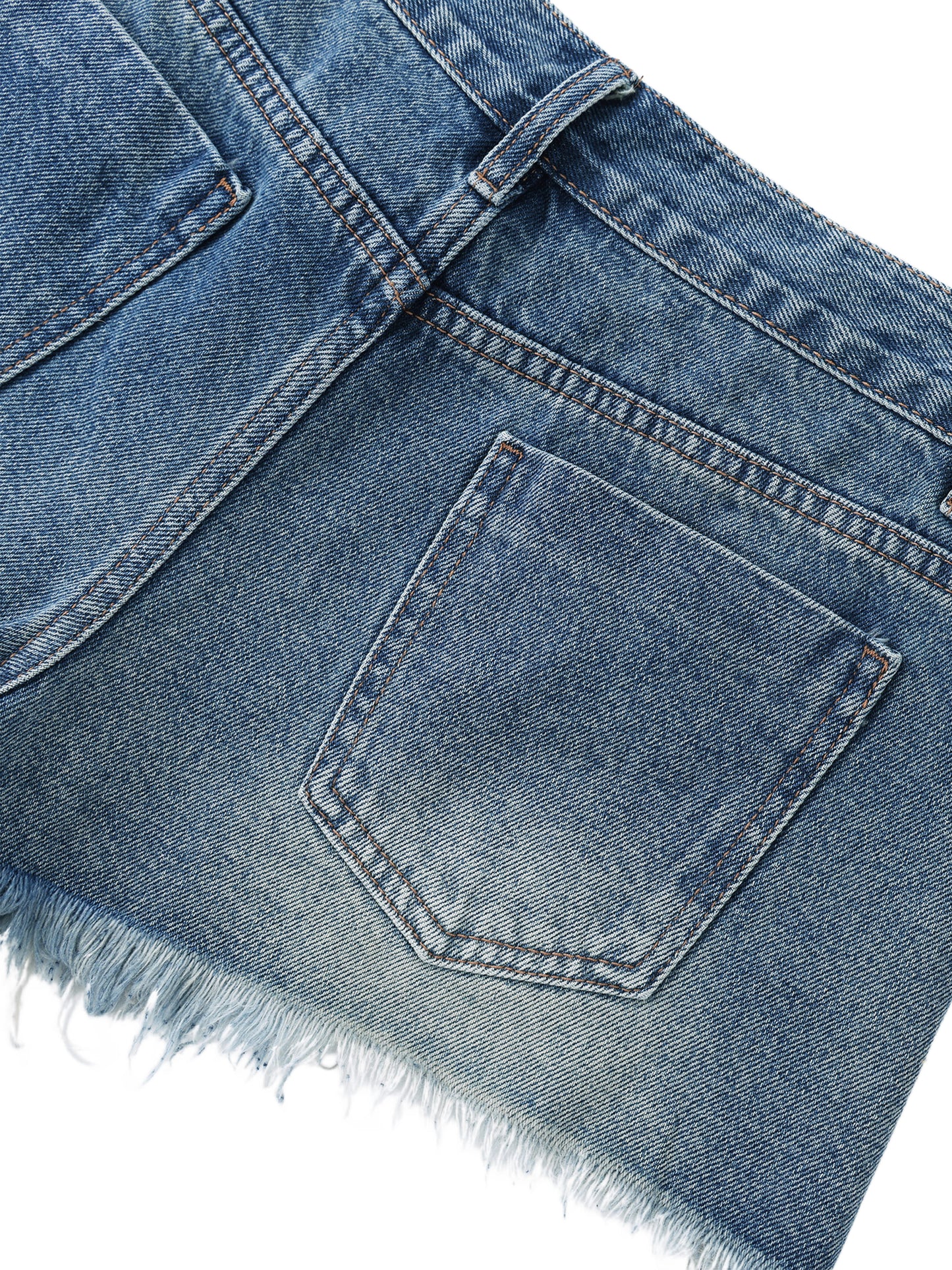 Close-up view of the classic back pocket stitching and heavily frayed raw edge hem on blue vintage wash denim shorts.