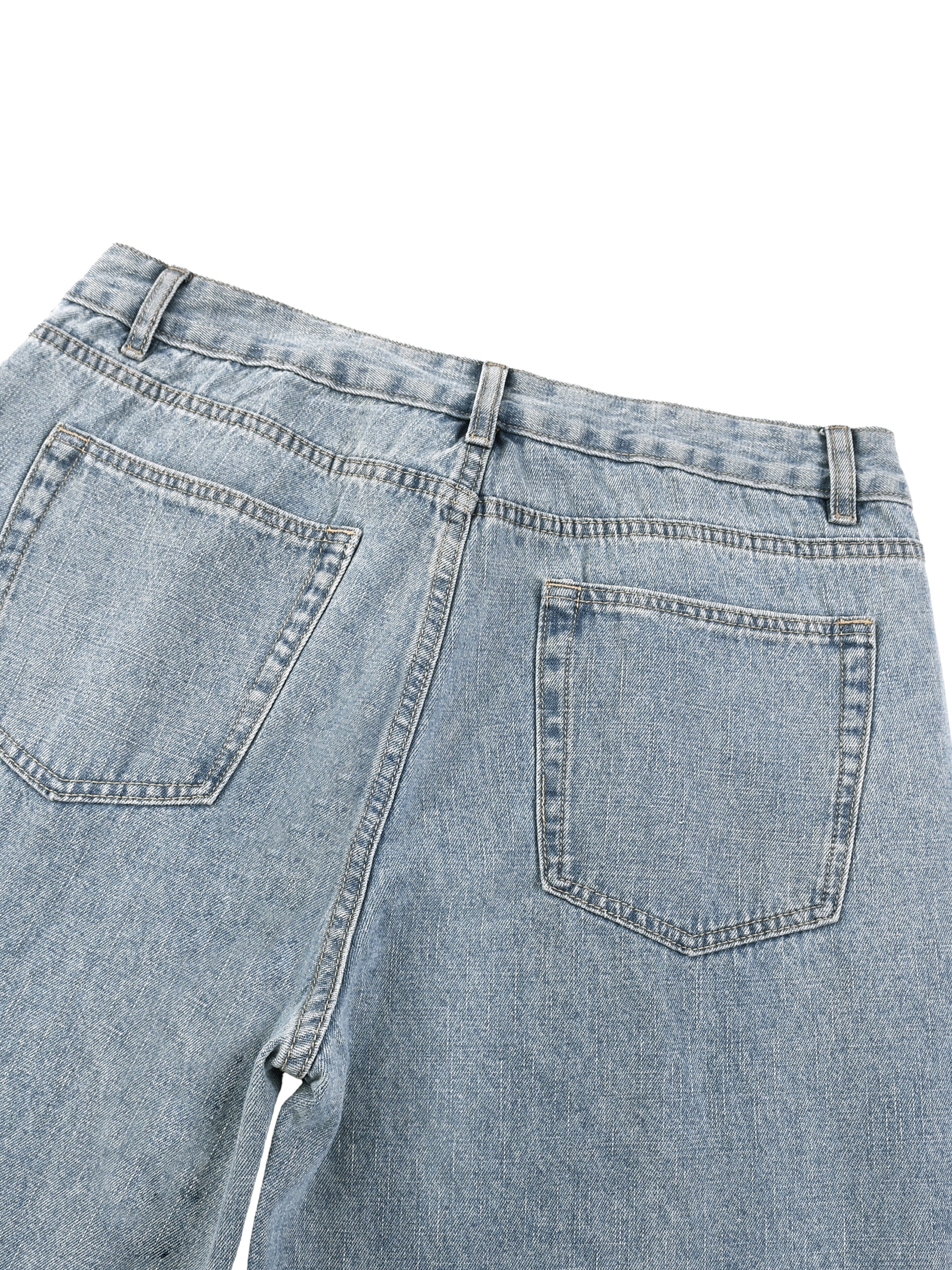Close-up rear view of the waistband and classic back pockets on unisex light blue vintage wash straight leg denim jeans.