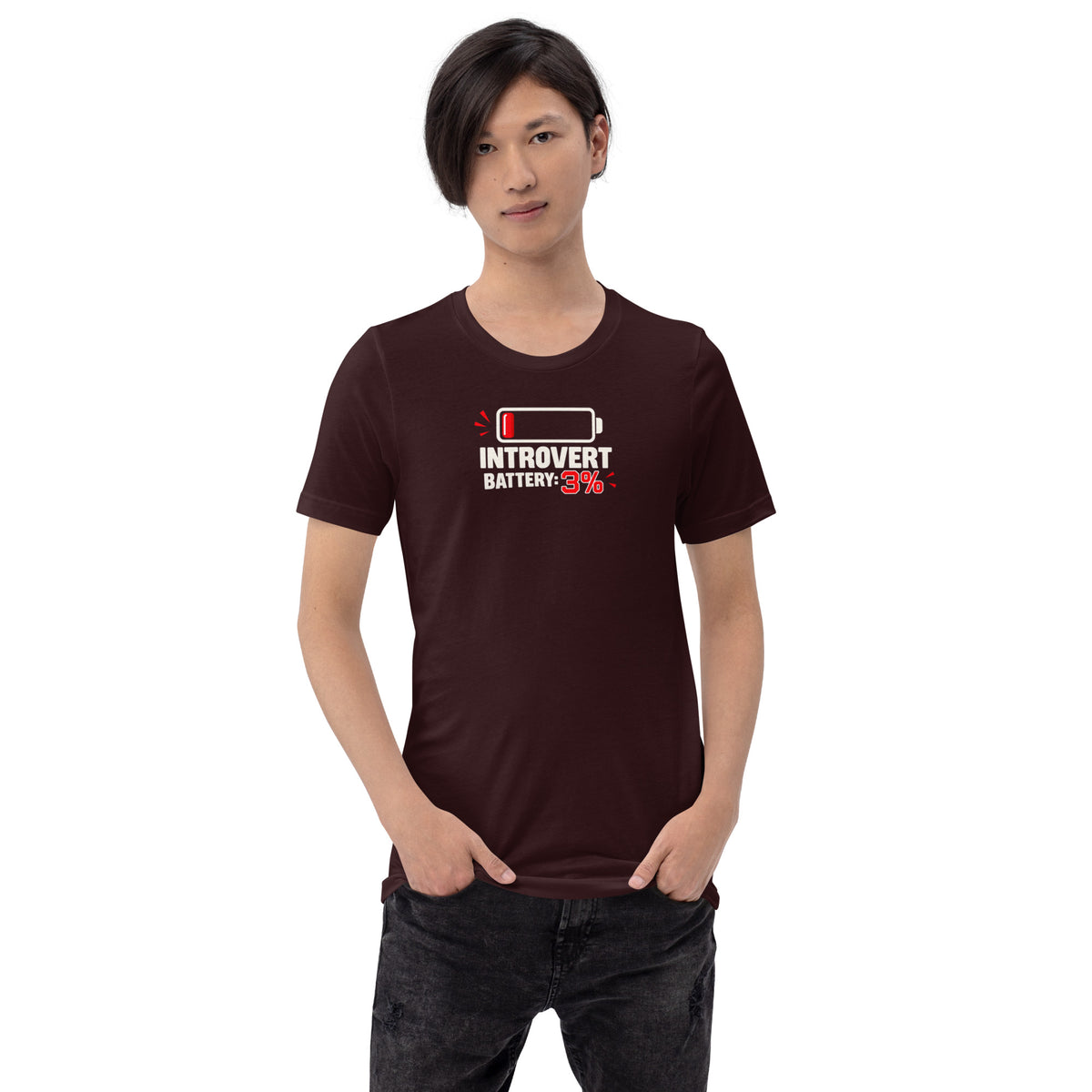 Front view of a male model standing wearing an oxblood black unisex t-shirt featuring a low battery icon and bold text reading Introvert Battery: 3%