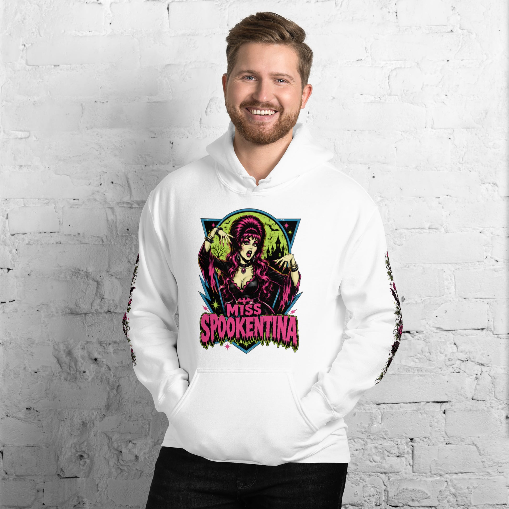 Male model wearing a black unisex pullover hoodie featuring a pink MS circular chest emblem and floral sleeve print