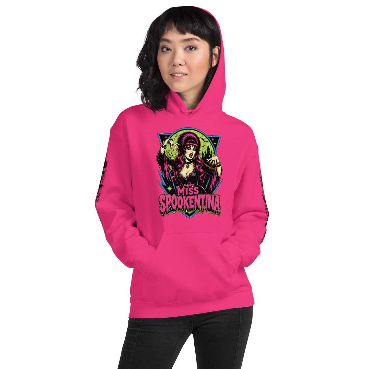 Smiling female model wearing a heliconia pink unisex pullover hoodie showing the front chest crest and pouch pocket