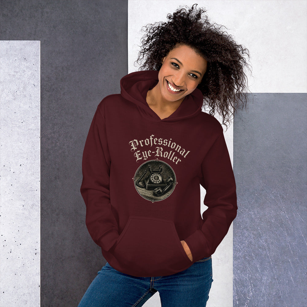 Front view of a smiling woman with curly hair wearing a maroon red Professional Eye-Roller unisex hoodie