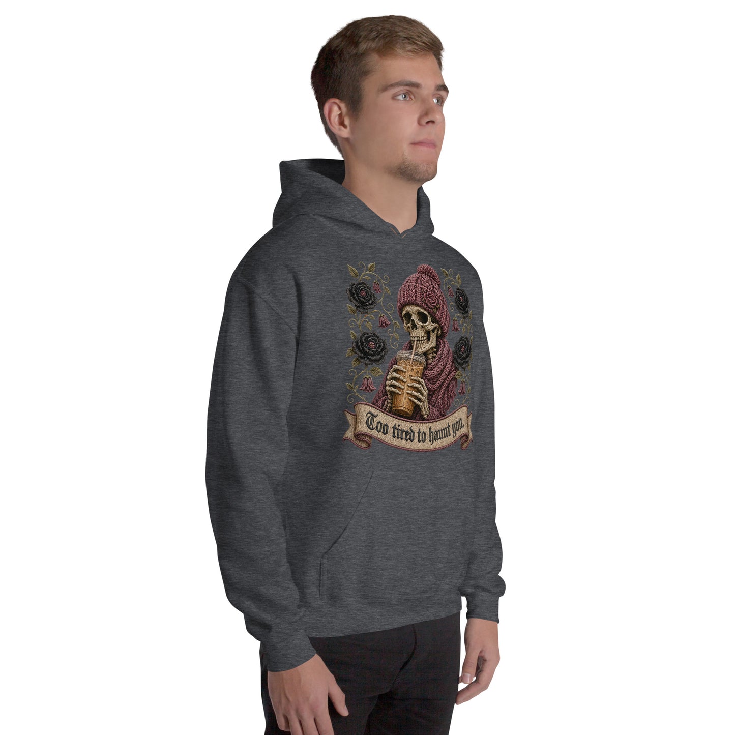 Male model standing wearing a graphite heather pullover hoodie with spooky season skeleton graphic