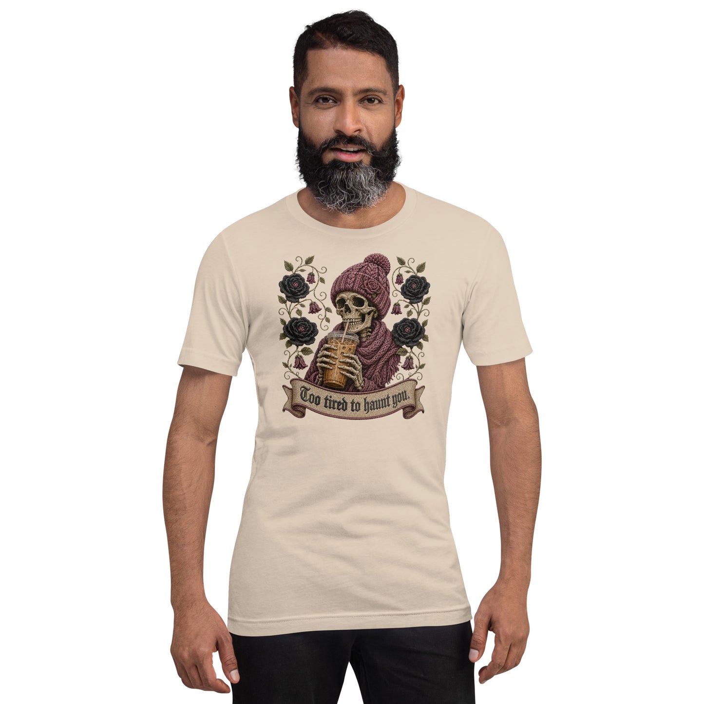 Bearded male model wearing soft cream unisex t-shirt with Too Tired to Haunt You skeleton design