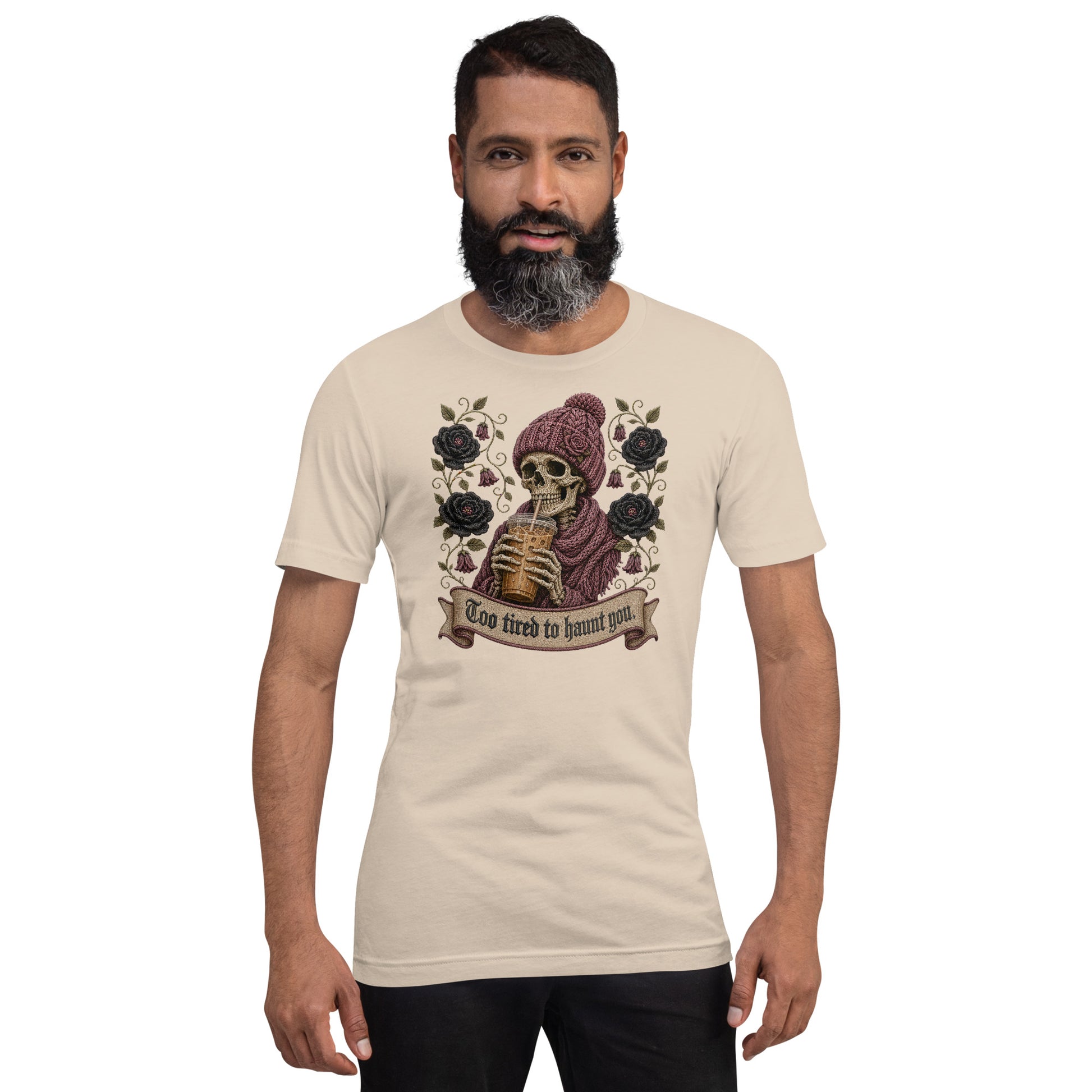 Bearded male model wearing soft cream unisex t-shirt with Too Tired to Haunt You skeleton design
