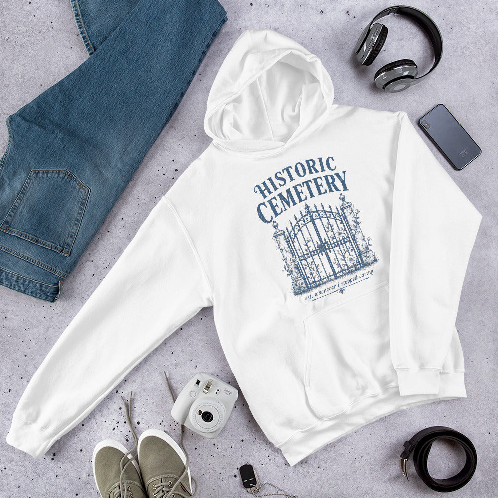 Cozy autumn aesthetic flat lay featuring gothic cemetery gates graphic sweatshirt.