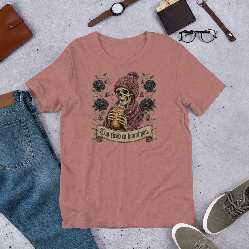 Styled aesthetic flat lay of heather mauve graphic t-shirt with sunglasses and accessories featuring gothic skeleton iced coffee design